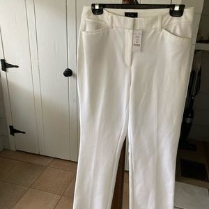 White dress pants, sits a waist
